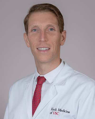Headshot of Adam Charles Frank