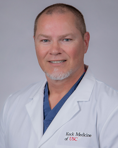 Headshot of Jason Sean Menadue
